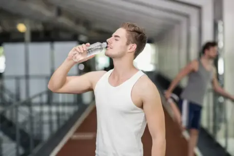 man drinking water