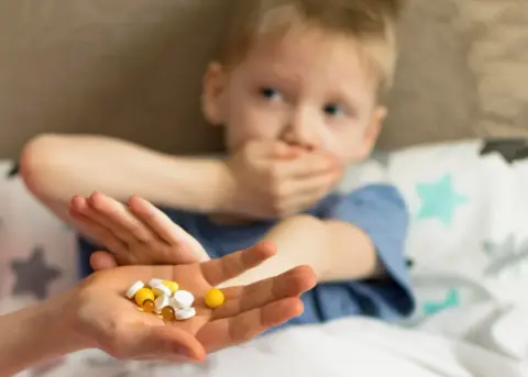 giving pills to kids